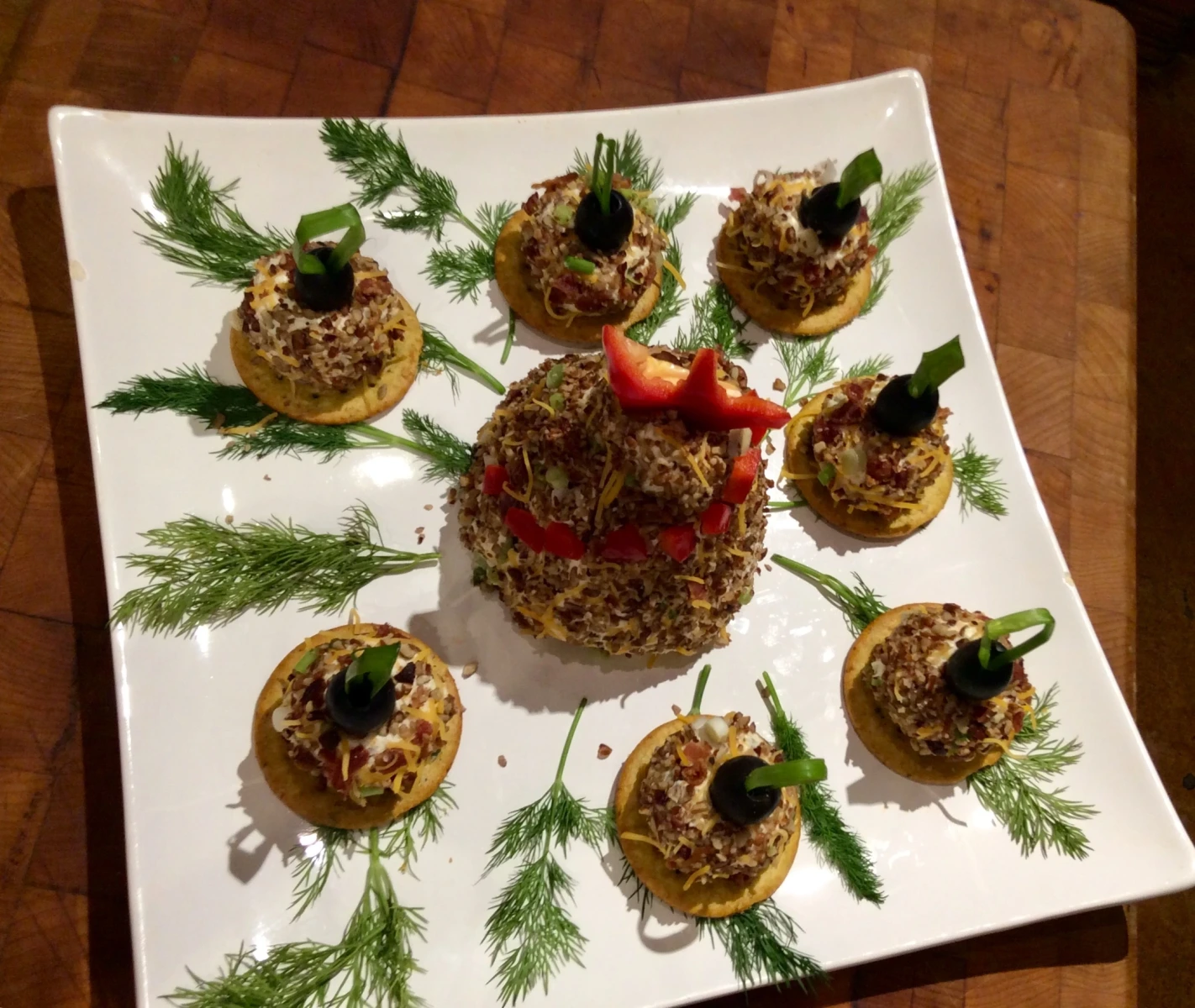 Cheese and bacon spheres on a cracker base