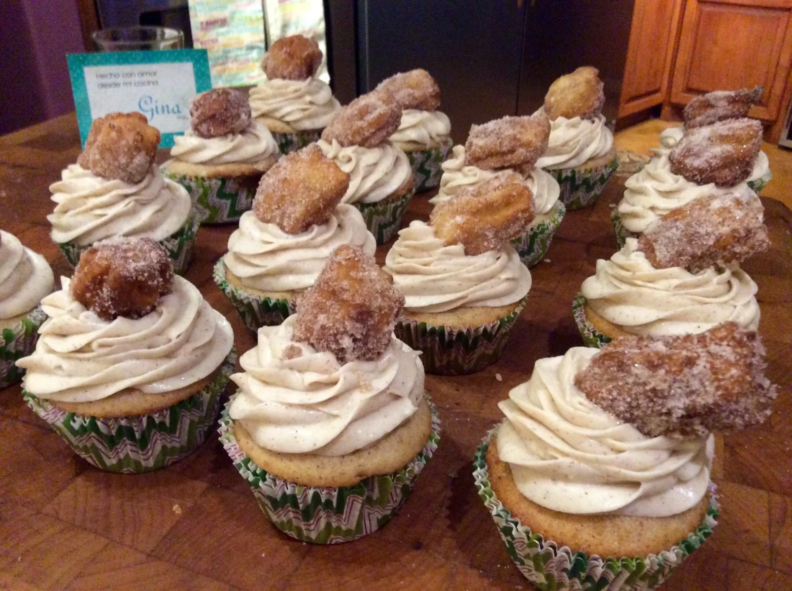 Plate of churro kekos decorated with mini churros and frosting