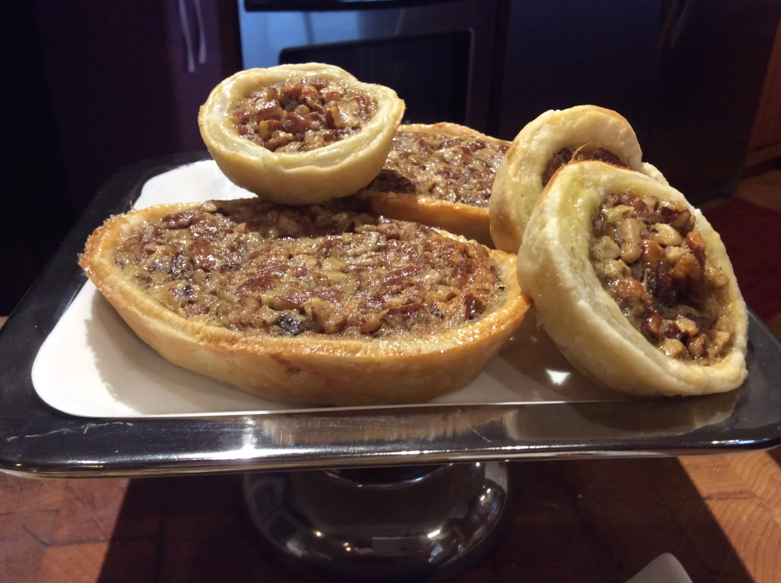 Tray of mini pecan pies with Christmas decorations