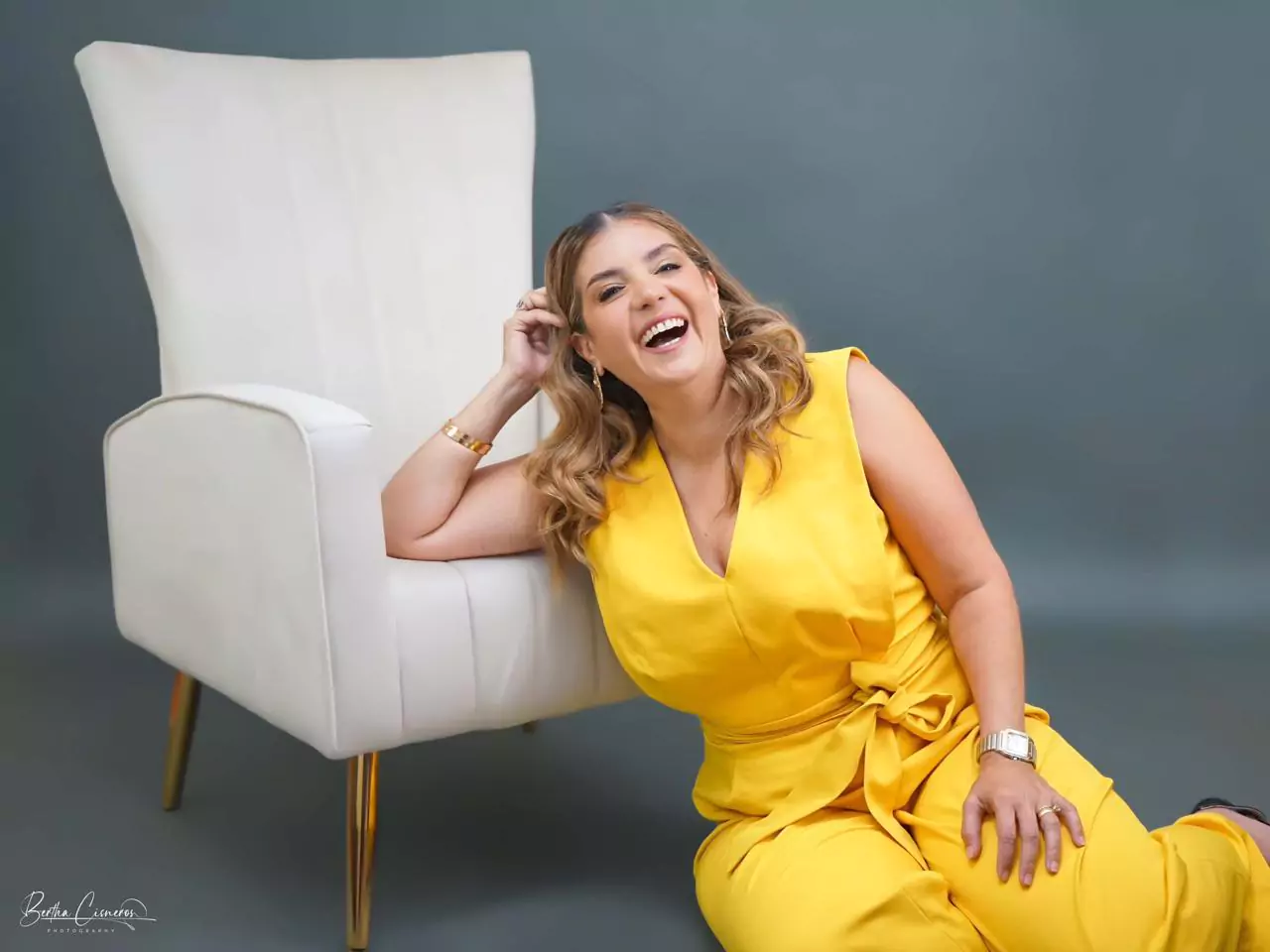 About ME 3 Gina Whitley showing one of her cookbooks with gourmet recipes.