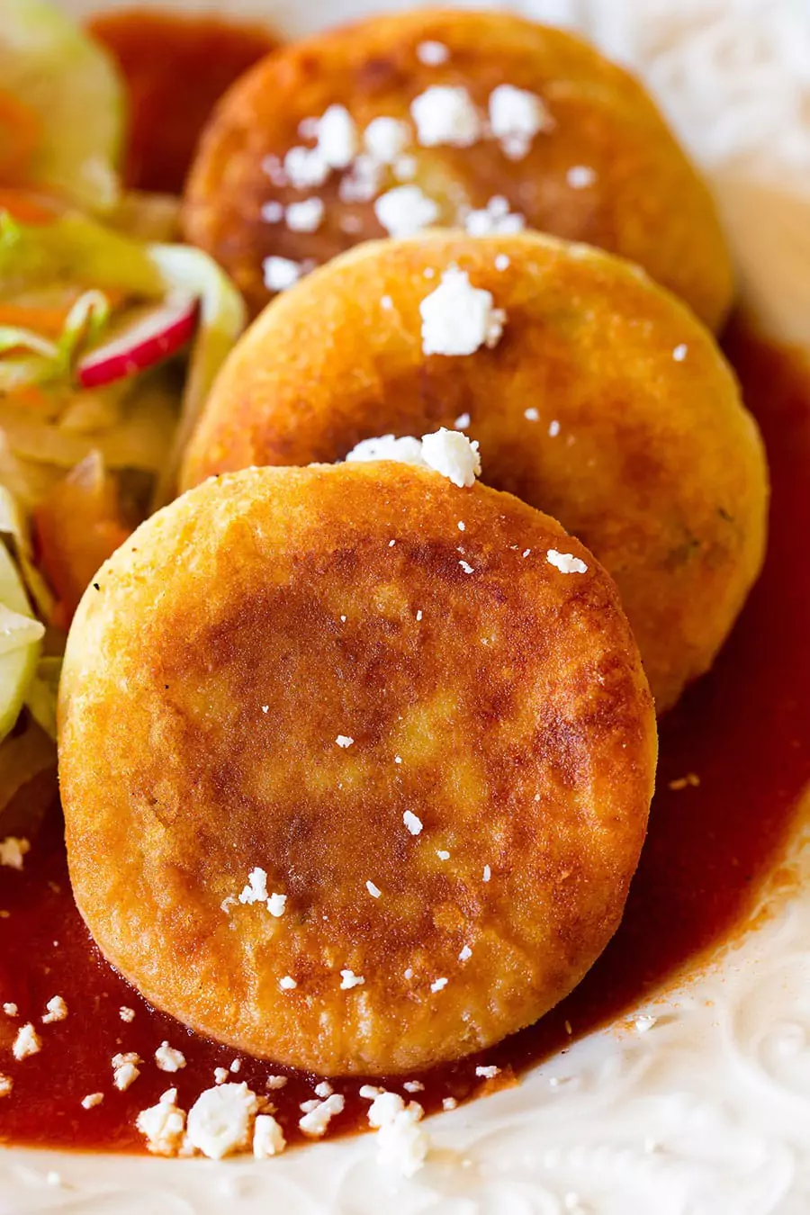 Recipe for golden and crispy potato cakes with cheese served with fresh salad