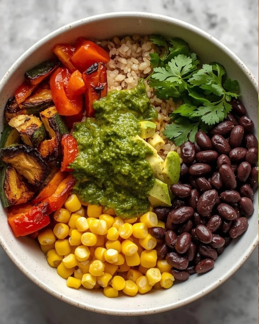 Colorful bowl with rice, black beans and roasted vegetables