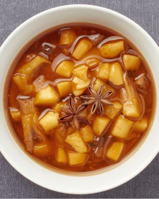 Warm apple compote with cinnamon and anise
